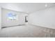 Spacious main bedroom featuring carpet floors, natural light and a ensuite bathroom at 16634 W 93Rd Way, Arvada, CO 80007