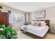 Inviting bedroom with large window, closet, and comfortable decor at 7995 E Mississippi Ave # C11, Denver, CO 80247