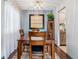 Inviting dining room featuring hardwood floors, a stylish light fixture, and kitchen views at 7995 E Mississippi Ave # C11, Denver, CO 80247