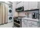 Bright kitchen features stainless steel appliances and stylish backsplash at 7995 E Mississippi Ave # C11, Denver, CO 80247