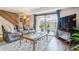 Comfortable living room with a large sliding glass door, opening to a small outdoor patio at 7995 E Mississippi Ave # C11, Denver, CO 80247