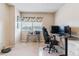 Home office with desk, chair, and natural light from window at 7995 E Mississippi Ave # C11, Denver, CO 80247