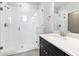 Modern bathroom featuring glass shower doors and a white marble countertop at 457 Interlocken Blvd # 101, Broomfield, CO 80021
