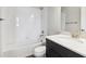 Bathroom featuring a shower-tub combo and a white marble countertop at 457 Interlocken Blvd # 101, Broomfield, CO 80021