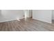 Hallway featuring modern gray wood floors and neutral walls at 457 Interlocken Blvd # 101, Broomfield, CO 80021
