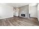 Open living room featuring modern tile fireplace, recessed lighting, and wood-look floors at 457 Interlocken Blvd # 101, Broomfield, CO 80021
