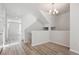 Open living room with modern chandelier and hardwood flooring at 457 Interlocken Blvd # 101, Broomfield, CO 80021