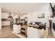 Open living space featuring a modern kitchen, living room, and dining area at 3461 N Buchanan Way, Aurora, CO 80019