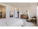 Comfortable main bedroom with cozy decor and a door leading to the main bathroom at 3461 N Buchanan Way, Aurora, CO 80019