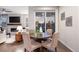 Cozy dining area with a view of the fireplace and outdoor scenery at 7257 S Millbrook Ct, Aurora, CO 80016