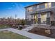 Inviting townhome with landscaped yard, stone accents, and well-maintained front walkway at 7257 S Millbrook Ct, Aurora, CO 80016