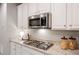 Gourmet kitchen featuring granite countertops, stainless steel appliances, and a gas cooktop at 7257 S Millbrook Ct, Aurora, CO 80016