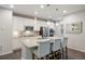 Bright kitchen boasts a large island with seating and granite counters, perfect for casual dining at 7257 S Millbrook Ct, Aurora, CO 80016