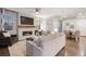 Spacious living room featuring a fireplace, hardwood floors, and open layout at 7257 S Millbrook Ct, Aurora, CO 80016