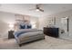 Serene main bedroom suite features a comfortable bed, soft lighting, and neutral decor for a relaxing retreat at 7257 S Millbrook Ct, Aurora, CO 80016