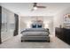 Spacious main bedroom with neutral décor, carpet, ceiling fan, and large windows with natural light at 7257 S Millbrook Ct, Aurora, CO 80016