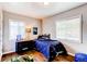 Charming bedroom with a nautical theme, hardwood floors, and ample natural light at 745 S Utica St, Denver, CO 80219