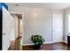 Spacious bedroom with hardwood flooring and neutral paint; the entrance to ensuite bathroom is visible at 745 S Utica St, Denver, CO 80219