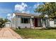 Charming single-story home with a well-manicured lawn and a detached garage at 745 S Utica St, Denver, CO 80219