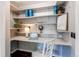 Conveniently located home office space featuring built-in shelving and desk, perfect for work or study at 745 S Utica St, Denver, CO 80219