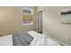 Bedroom features a cozy bed and window with light-blocking shades at 8255 E 150Th Pl, Thornton, CO 80602