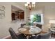 Charming dining area with dark wood cabinets and a view of the backyard at 8255 E 150Th Pl, Thornton, CO 80602
