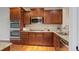 Well-equipped kitchen with stainless steel appliances, granite countertops, and a gas cooktop at 8255 E 150Th Pl, Thornton, CO 80602