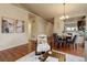 Living room area including hardwood floors and a dining table at 8255 E 150Th Pl, Thornton, CO 80602