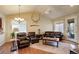 Bright and airy living room with hardwood floors and a combination of modern and rustic decor at 8255 E 150Th Pl, Thornton, CO 80602