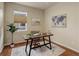 Cozy office featuring a wood desk, neutral paint, and stylish decor at 8255 E 150Th Pl, Thornton, CO 80602