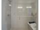 Large walk-in shower with glass enclosure and bench at 31191 Black Eagle Dr # 102, Evergreen, CO 80439