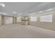 Spacious finished basement with a large open area, recessed lighting, and a convenient bar area perfect for entertaining at 10116 Quivas St, Thornton, CO 80260