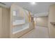 Basement staircase featuring modern built-in shelving, perfect for storage and display at 10116 Quivas St, Thornton, CO 80260