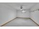 Bright bedroom featuring a ceiling fan, window and neutral-toned carpeted floor at 10116 Quivas St, Thornton, CO 80260