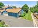Aerial view of the home showcasing the well-maintained landscape, mature trees, and convenient parking area at 10116 Quivas St, Thornton, CO 80260