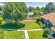 Expansive front lawn featuring mature trees and manicured landscaping, enhancing curb appeal at 10116 Quivas St, Thornton, CO 80260