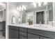 Bright bathroom features a dual sink vanity, with lots of storage, and framed mirrors at 4922 Lowell Blvd # 2, Denver, CO 80221