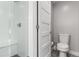Modern bathroom features a glass-enclosed shower with seat and a toilet at 4922 Lowell Blvd # 2, Denver, CO 80221