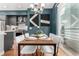 Chic dining space with an open view to the kitchen, a view to the balcony, stylish lighting, and modern decor at 4922 Lowell Blvd # 2, Denver, CO 80221