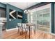 Modern dining area featuring stylish decor, hardwood floors, contemporary chandelier and bright natural lighting at 4922 Lowell Blvd # 2, Denver, CO 80221