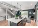 Modern kitchen island overlooking the staircase, Gathering room, and outdoor balcony at 4922 Lowell Blvd # 2, Denver, CO 80221