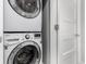 Close-up of a stacked washer and dryer set in a laundry area at 4922 Lowell Blvd # 2, Denver, CO 80221