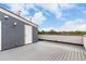 Rooftop deck features wood-like flooring and access door, ideal for relaxation and enjoying the outdoors at 4922 Lowell Blvd # 2, Denver, CO 80221