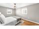 Cozy bedroom with hardwood floors and a large window at 2610 Poplar St, Denver, CO 80207