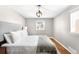Bright bedroom with hardwood floors and large window at 2610 Poplar St, Denver, CO 80207