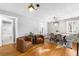 Open dining room features wood floors, a modern table and chairs, and natural light at 2610 Poplar St, Denver, CO 80207