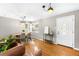 Inviting entryway featuring hardwood floors, ample lighting, and an stylish table at 2610 Poplar St, Denver, CO 80207