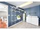 Laundry room with washer, dryer, shelving, and water heater at 2610 Poplar St, Denver, CO 80207