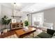 Bright living room featuring hard wood floors, stylish furniture, and a neutral color palette at 2610 Poplar St, Denver, CO 80207