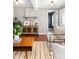 Bright living room features hardwood floors, stylish furniture, and large windows at 2610 Poplar St, Denver, CO 80207